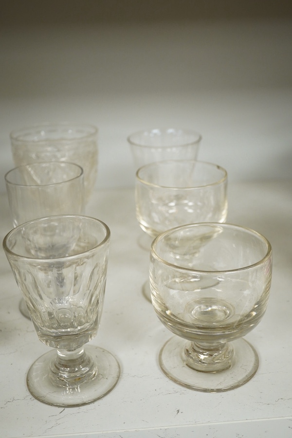 Eleven 19th century glass rummers including two engraved runners, one engraved with fruiting vines and dated 1867 (cracked). Condition - fair, one cracked, and a chip to the rim of another.